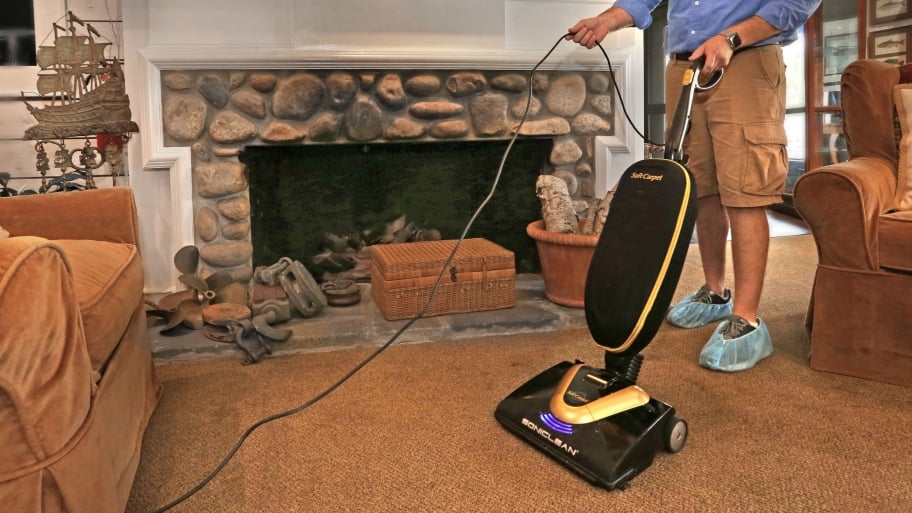 man cleaning carpet